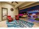 The back patio features comfortable seating, a ceiling fan, and stylish decor at 8127 E June St, Mesa, AZ 85207