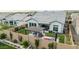 This yard boasts a manicured lawn, a pergola with seating, and colorful flowers at 8127 E June St, Mesa, AZ 85207