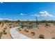 Community basketball court surrounded by desert landscaping, walking path, and benches for outdoor enjoyment at 8127 E June St, Mesa, AZ 85207