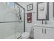 The bathroom includes a sleek glass shower, modern fixtures, and neutral-toned walls and flooring at 8127 E June St, Mesa, AZ 85207