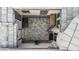 Aerial photo of a private outdoor courtyard with pavers, a seating area, and a touch of greenery at 8127 E June St, Mesa, AZ 85207