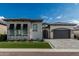 Beautiful home featuring a paved driveway, two car garage, and a well-maintained lawn and desert landscaping at 8127 E June St, Mesa, AZ 85207