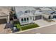 Beautiful single-story home featuring a paver driveway, manicured lawn, and a neutral color scheme at 8127 E June St, Mesa, AZ 85207