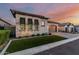 Charming single-Gathering home boasts a paver driveway, two-car garage, and manicured front yard with beautiful desert plants at 8127 E June St, Mesa, AZ 85207