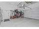 This organized garage has ample storage, including shelving and overhead racks at 8127 E June St, Mesa, AZ 85207