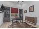 This well appointed office features vaulted ceilings, shiplap, exposed brick, and a large desk at 8127 E June St, Mesa, AZ 85207
