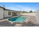 Backyard features an in-ground pool with a gray brick surround and privacy walls at 8430 E Fairmount Ave, Scottsdale, AZ 85251