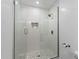 Modern bathroom featuring tiled glass shower with rain shower head and mosaic tiling at 8430 E Fairmount Ave, Scottsdale, AZ 85251