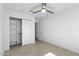 Bedroom featuring a ceiling fan and sliding closet door at 8430 E Fairmount Ave, Scottsdale, AZ 85251