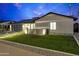 Beautiful home with a modern garage, walkway lighting, and well-maintained lawn at 8430 E Fairmount Ave, Scottsdale, AZ 85251