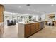 Open-concept kitchen with a large island, seamlessly connecting to the dining and living spaces at 8430 E Fairmount Ave, Scottsdale, AZ 85251