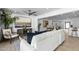 Bright, open living room with modern furnishings and decor, flowing into the dining area at 8430 E Fairmount Ave, Scottsdale, AZ 85251