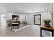 Spacious living area featuring tile floors, sleek furniture, neutral tones, and an abundance of natural light at 8430 E Fairmount Ave, Scottsdale, AZ 85251
