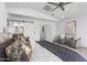 Cozy bedroom featuring vaulted ceilings and a view of the ensuite bathroom at 8430 E Fairmount Ave, Scottsdale, AZ 85251