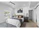 Bright bedroom suite showcasing a modern design, neutral decor, and backyard views at 8430 E Fairmount Ave, Scottsdale, AZ 85251