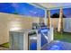 Outdoor kitchen with stainless steel grill, granite counters, and refrigerator at 8430 E Fairmount Ave, Scottsdale, AZ 85251