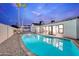 Sparkling pool with spacious patio, lounge chairs, and landscaped yard at 8430 E Fairmount Ave, Scottsdale, AZ 85251