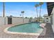 Backyard pool area with palm trees, patio, and a built in stainless grill and sink under a pergola at 8430 E Fairmount Ave, Scottsdale, AZ 85251