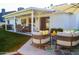 Inviting backyard with patio furniture, lush grass, and charming details, perfect for outdoor relaxation and entertaining at 864 W Monte Ave, Mesa, AZ 85210
