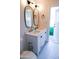 Bathroom featuring a double sink vanity and an exit to outside at 864 W Monte Ave, Mesa, AZ 85210