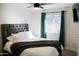 Comfortable bedroom with large window and soft, tufted headboard at 864 W Monte Ave, Mesa, AZ 85210
