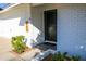 Charming home featuring a black front door with a 'hello' welcome mat and white brick exterior at 864 W Monte Ave, Mesa, AZ 85210