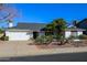 Charming single-story home featuring a well-maintained yard and attached two-car garage at 864 W Monte Ave, Mesa, AZ 85210