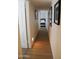 Hallway featuring hardwood floors and bedroom views at 864 W Monte Ave, Mesa, AZ 85210