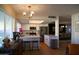 Open concept kitchen showcasing stainless steel appliances, white cabinets, and a clear view to the dining area at 864 W Monte Ave, Mesa, AZ 85210