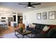 Inviting living room with a dark gray sofa and adjacent kitchen at 864 W Monte Ave, Mesa, AZ 85210