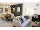 Open-concept living room and dining room featuring stylish decor, comfortable seating, and modern lighting at 864 W Monte Ave, Mesa, AZ 85210