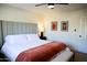Bright bedroom features neutral paint, a comfortable bed, and tasteful decorations at 864 W Monte Ave, Mesa, AZ 85210