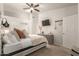 Relaxing bedroom featuring a modern ceiling fan, neutral decor, and an adjacent closet at 875 S Nebraska St # 69, Chandler, AZ 85225