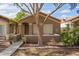 Inviting single-story house with a low wall across the front yard and desert landscaping at 875 S Nebraska St # 69, Chandler, AZ 85225