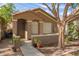 Single-story home with a tile roof, arched entry, and a sidewalk leading to the front door at 875 S Nebraska St # 69, Chandler, AZ 85225