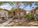 Charming single-story home featuring a cozy front porch and mature landscaping at 875 S Nebraska St # 69, Chandler, AZ 85225