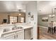 Open-concept kitchen featuring quartz countertops, stainless steel appliances and dishwasher at 875 S Nebraska St # 69, Chandler, AZ 85225