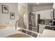 Bright kitchen boasts stainless steel appliances, undermount sink, and stylish quartz countertops at 875 S Nebraska St # 69, Chandler, AZ 85225