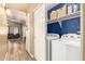 Bright laundry area with washer, dryer, storage shelves, and well-lit space at 875 S Nebraska St # 69, Chandler, AZ 85225