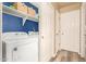 Bright laundry area with washer, dryer, storage shelves, and well-lit space at 875 S Nebraska St # 69, Chandler, AZ 85225