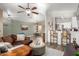 Open concept living room with modern ceiling fan and view of the breakfast bar at 875 S Nebraska St # 69, Chandler, AZ 85225