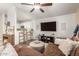 Open concept living room with TV, hardwood floors and lots of natural light at 875 S Nebraska St # 69, Chandler, AZ 85225