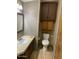 Compact bathroom with modern fixtures, vanity, and built-in cabinet storage at 9427 E University Dr # 48, Mesa, AZ 85207