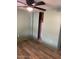 Bedroom with green walls, laminate flooring and a closet with sliding doors at 9427 E University Dr # 48, Mesa, AZ 85207