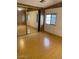 Bright bedroom with mirrored closet doors and natural light from the window at 9427 E University Dr # 48, Mesa, AZ 85207