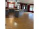 Bright open kitchen with gray cabinets, stainless steel appliances, and a large island at 9427 E University Dr # 48, Mesa, AZ 85207