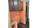 Practical laundry area with overhead cabinets and potential for customization at 9427 E University Dr # 48, Mesa, AZ 85207