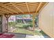 Covered patio with backyard featuring green grass and mature trees at 9967 W Devonshire Ave, Phoenix, AZ 85037