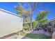 Backyard with covered patio and green grass at 9967 W Devonshire Ave, Phoenix, AZ 85037