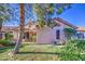 Backyard view featuring a patio, house, and green grass at 9967 W Devonshire Ave, Phoenix, AZ 85037